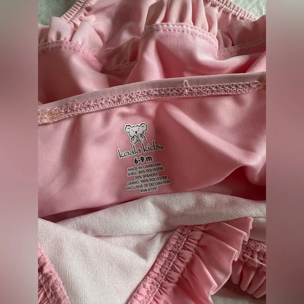 Baby pink swimsuit size 6-9 months